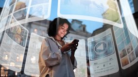 An incredibly beautiful curly-haired woman is using an augmented reality phone to browse web pages, apps, and social networks. A woman uses her phone while walking down a city street at night - Powered by Shutterstock - Get 15% off with code: PIKWIZARD15