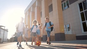 children near the school playing soccer. kids a school education kid dream concept. a group of children near the school playing ball lifestyle. a group of school children playing - Powered by Shutterstock - Get 15% off with code: PIKWIZARD15