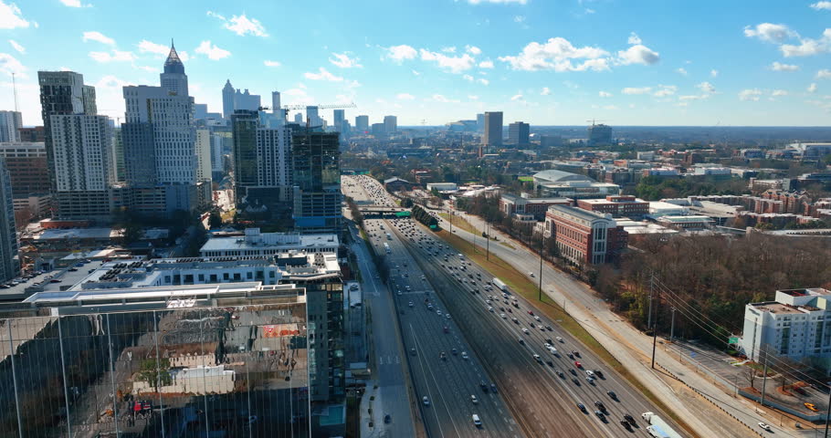Downtown Atlanta, Georgia. Skyscrapers in the business center with Interstate 85 and general view of Georgia Institute of Technology. Aerial view.