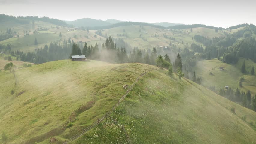 Summer morning in Bucovina. Aerial 4K video over folk scenery mountain hills villages in the north part of Romania, next to Neamt and Suceava.