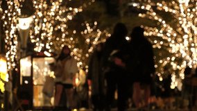 TOKYO, JAPAN - DECEMBER 2023 : View of Christmas illumination light up at Marunouchi area. Japanese winter city and romantic Christmas night concept video. Time lapse shot.