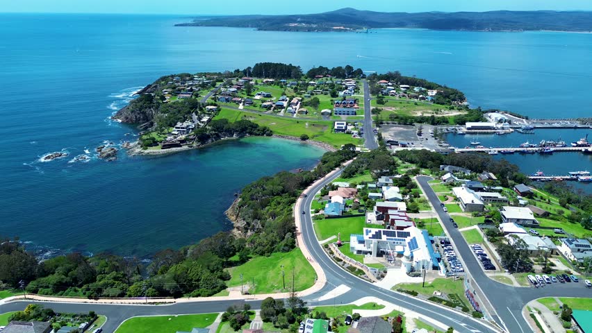Drone aerial landscape residential street housing commercial shops Killer Whale museum Eden lookout point Sapphire Coast Twofold Bay Australia Royalty-Free Stock Footage #3419012731