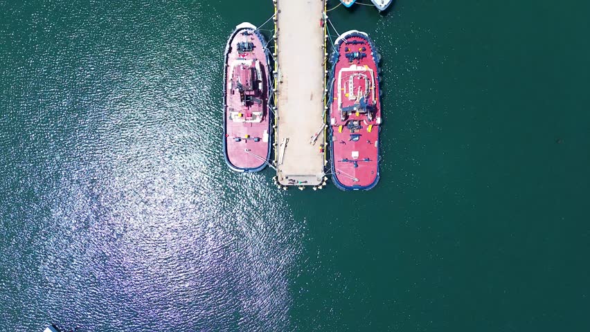 Drone aerial bird's-eye view wharf dock waterfront infrastructure fishing trawlers marine port Eden Twofold Bay Sapphire Coast Australia Royalty-Free Stock Footage #3419013889