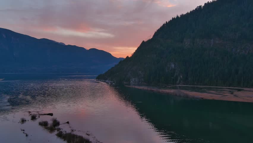Scenic Ocean Coast and Mountains in Howe Sound. Cloudy Sunset Sky, Fall Season. Howe Sound, British Columbia Canada. Royalty-Free Stock Footage #3419050707
