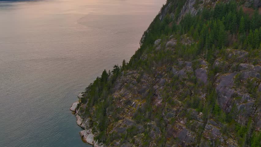 Scenic Ocean Coast and Mountains in Howe Sound. Cloudy Sunset Sky, Fall Season. Howe Sound, British Columbia Canada. Royalty-Free Stock Footage #3419051167