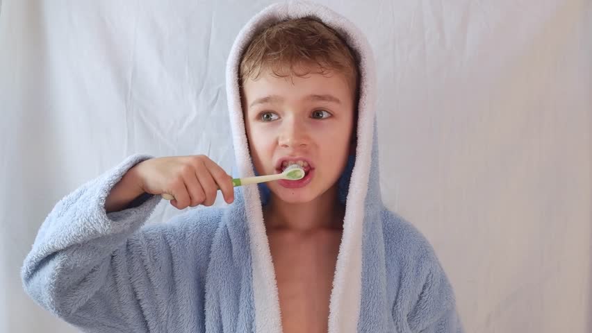 Portrait happy smiling child kid boy brushing teeth toothbrush on white , Health care, dental hygiene Royalty-Free Stock Footage #3419072039