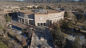 New Mexico State capitol building in Santa Fe, New Mexico with drone video pulling back.