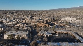 The Cathedral Basilica of St. Francis of Assisi in Santa Fe, New Mexico with drone video wide shot from the side moving in.