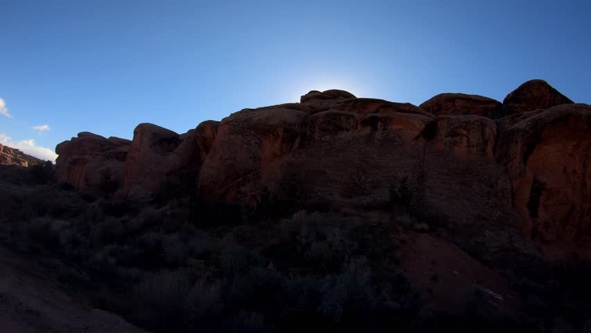 A side view experiencing the breathtaking beauty of Utah’s rugged terrain as you embark on an off-road adventure through Gemini Bridges Trail