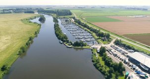 Dutch Inland Yacht Club Filled With Boats - Friesland, The Netherlands, 4K Drone Footage
