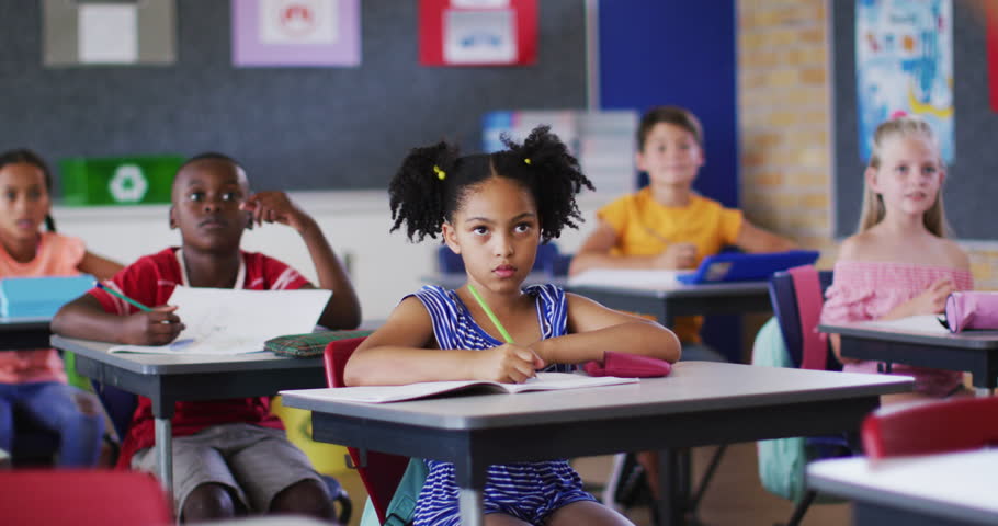 Diverse schoolchildren sitting in classroom raising hands to answer questions during lesson. children at primary school. Royalty-Free Stock Footage #3419224641