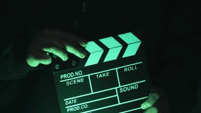Video of anonymous person using a clapperboard in a local film production. Concept of film and video industry.