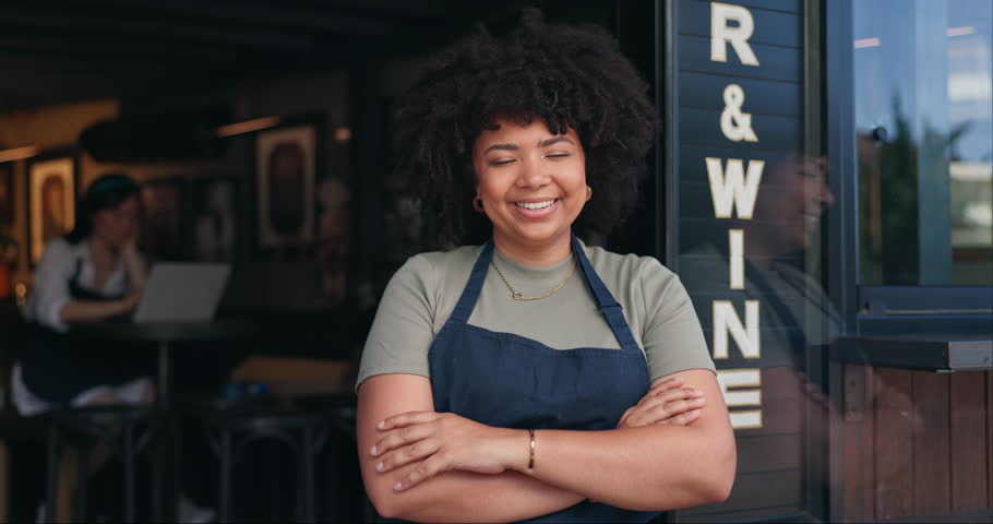 Happy black woman, cafe and owner by door of small business in confidence for management. Portrait of young African female person or waitress smile with arms crossed of professional at coffee shop Royalty-Free Stock Footage #3419277145