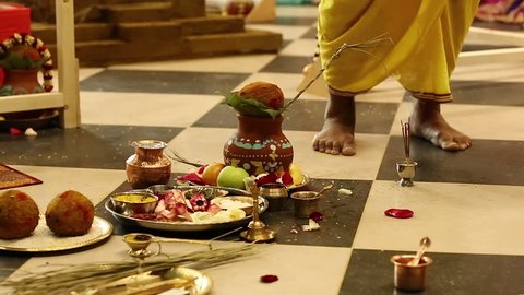 Deity installation ceremony in the Krishna temple, feet of Krishna worshipper