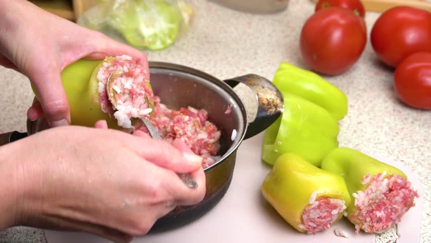 Preparing stuffed peppers. Stuffing peppers with minced meat. Step-by-step cooking video recipe.  Royalty-Free Stock Footage #3419292503