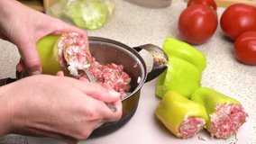 Preparing stuffed peppers. Stuffing peppers with minced meat. Step-by-step cooking video recipe. 