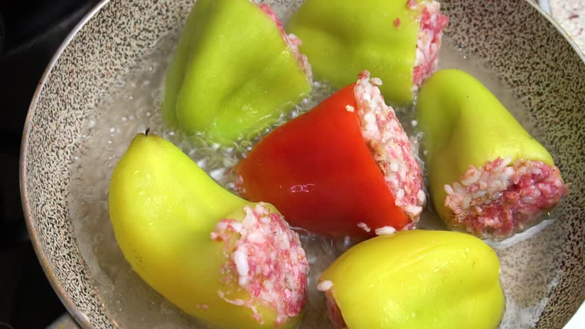 Preparing stuffed peppers. Stuffed peppers are cooked in a frying pan. Step-by-step cooking video recipe. Cooking master class. Royalty-Free Stock Footage #3419293685