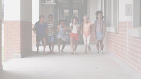 Animation of connected jigsaw puzzle pieces over happy diverse children running out of classroom. Digital composite, multiple exposure, childhood, togetherness and autism awareness concept. - Powered by Shutterstock - Get 15% off with code: PIKWIZARD15