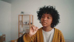 African American woman uses technologies. A young woman moves her hand to a program interface using the artificial visualization hologram. Business technologies concept for visualization touchscreen. - Powered by Shutterstock - Get 15% off with code: PIKWIZARD15