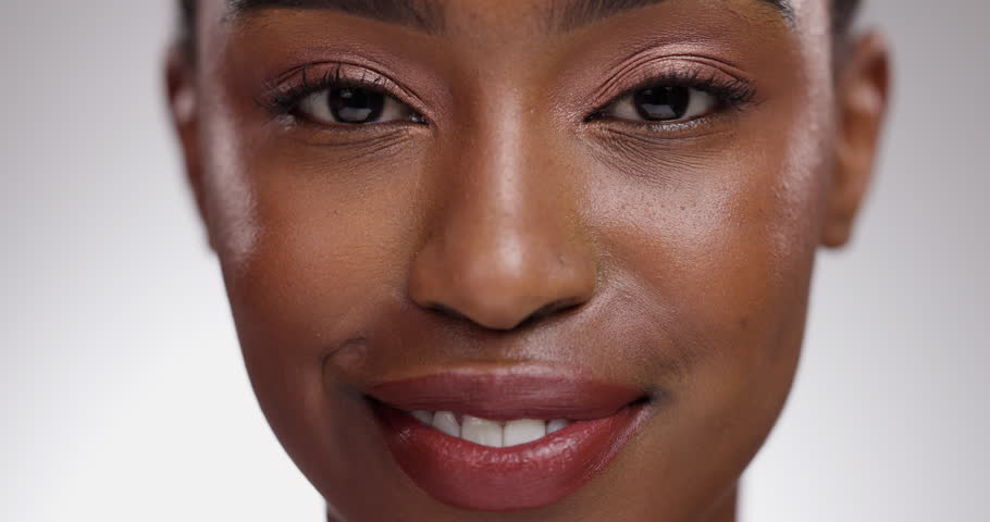 Makeup, skincare and face of black woman on a white background for wellness, cosmetics and beauty. Dermatology, spa and closeup portrait of happy person for natural, healthy skin or glow in studio