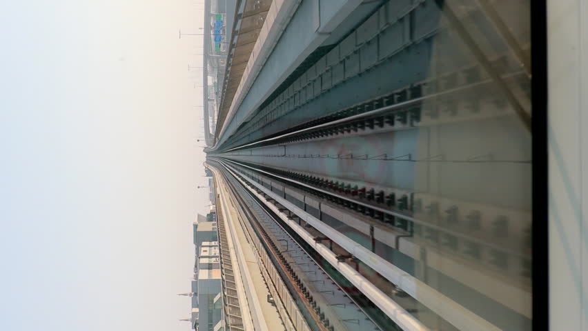 Dubai, UAE, United Arab Emirates. Monorail POV Subway train ride in Dubai. Traffic On Street In Dubai.