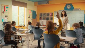 Caring Teacher Explaining a Math Lesson to a Classroom Full of Bright Diverse Children. Little Girl Raising Her Hand and Asking Tutor a Question. Primary School with a Group of Smart Multiethnic Kids - Powered by Shutterstock - Get 15% off with code: PIKWIZARD15