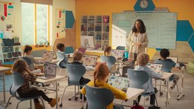 Class of Young Multiethnic Children Using Laptop Computers while Studying Math and Geometry in Grade School. Happy Female Teacher Explains Shapes and Measurements to Smart Boys and Girls - Powered by Shutterstock - Get 15% off with code: PIKWIZARD15