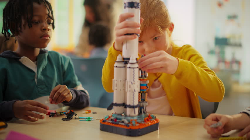 Smart Boys and Talented Girls Making a Model of a Modern Multiplanetary Space Rocket. Young Gifted Future Engineers Studying Science, Engineering, Space and Technology in Primary STEM School