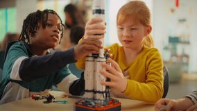 Smart Boys and Talented Girls Making a Model of a Modern Multiplanetary Space Rocket. Young Gifted Future Engineers Studying Science, Engineering, Space and Technology in Primary STEM School - Powered by Shutterstock - Get 15% off with code: PIKWIZARD15