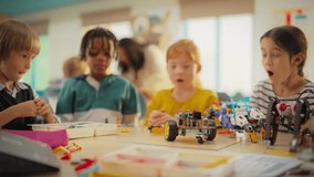 Team of Kids Finishing a Science Project. Talented Boys and Girls Created a Functioning Electric Vehicle Chassis. Primary School Classroom with Children Working on Futuristic Technology - Powered by Shutterstock - Get 15% off with code: PIKWIZARD15