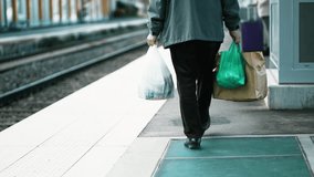 Elderly Gentleman Carrying Groceries at Train Station - Regular Commute - Powered by Shutterstock - Get 15% off with code: PIKWIZARD15