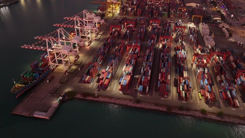 Shipyard industry shipping seafaring vessel at sunries. Cargo container depot port logistics transportation industry concept. Port operations for import export conmercial shipping to customs service