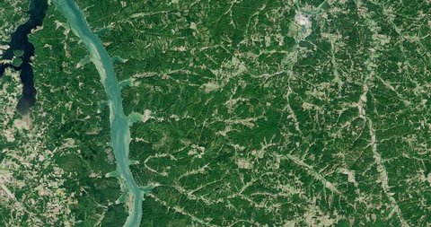 Very high-altitude overflight aerial of forest, lakes and farmland, western Kentucky. Clip loops and is reversible. Elements of this image furnished by NASA