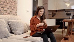 Young woman working online with her clients