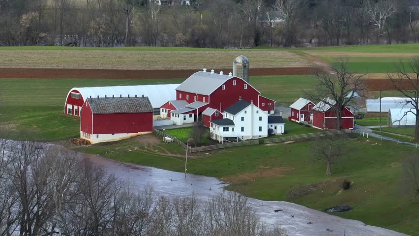Aerial shot of flooding on farm property. Amish fields near stream.