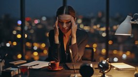 Night worker massaging head rub temples at cityscape. Tired businesswoman work late brainstorming ideas in contemporary dark office. Stressed manager feeling headache fatigue thinking problem solution - Powered by Shutterstock - Get 15% off with code: PIKWIZARD15