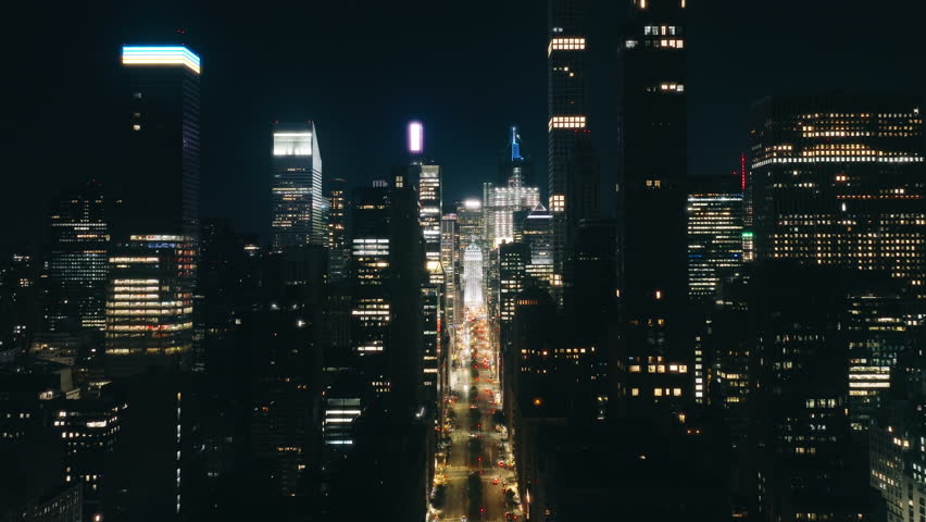 New York city night evening buildings downtown skyline. Skyscrapers finance district. Aerial flight over NYC downtown illuminated at night. Night traffic aerial.Big Apple cityscape at night drone shot Royalty-Free Stock Footage #3419866569