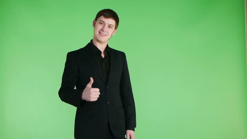 young optimistic businessman showing thumbs up