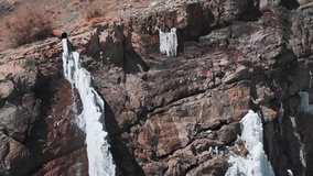 Closeup shot of frozen Lingti waterfall as seen on the way to Kaza at Spiti Valley in Himachal Pradesh, India. Frozen waterfall during the winter season at Spiti in India. Natural background.  - Powered by Shutterstock - Get 15% off with code: PIKWIZARD15