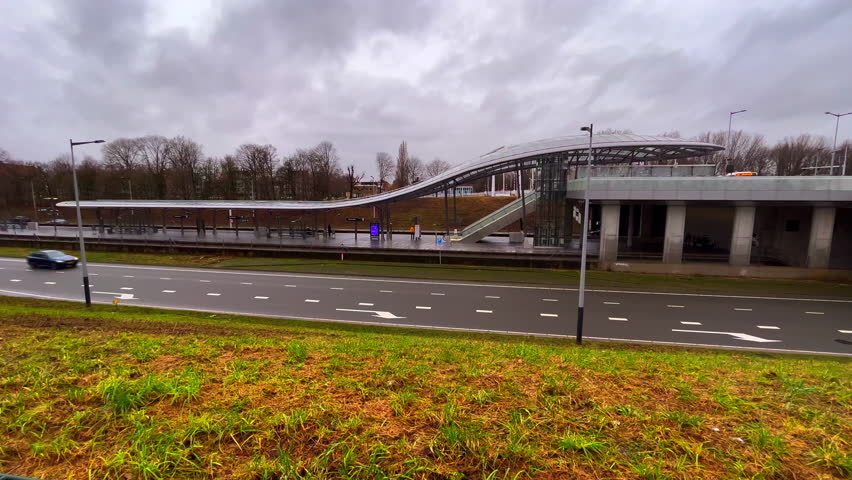 Noorderpark metro station in Amsterdam Noord wide total on a grey windy day