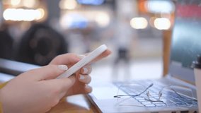Young woman using smartphone at mall. Caucasian girl looking at mobile phone. Communication, work or study, connection, mobile apps, technology, lifestyle concept 4K - Powered by Shutterstock - Get 15% off with code: PIKWIZARD15