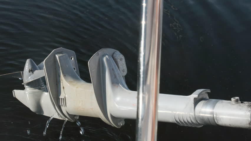 Boat propeller pulled out of water after sailing in sea. Vessel experienced unforeseen propulsion malfunction against water surface