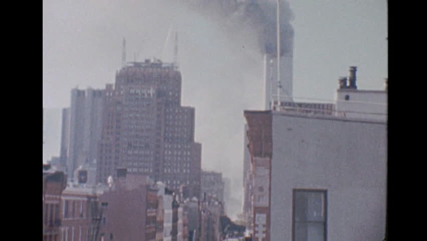 The rubble of the collapsed World Trade Center after terrorist attacks, in New York City, New York, USA, September 11, 2001. This footage was filmed with a super 8 film camera from a rooftop at Prince Royalty-Free Stock Footage #3420269197
