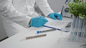 Healthcare professional in lab coat writing on a clipboard with test tubes and a centrifuge in a modern laboratory setting. - Powered by Shutterstock - Get 15% off with code: PIKWIZARD15