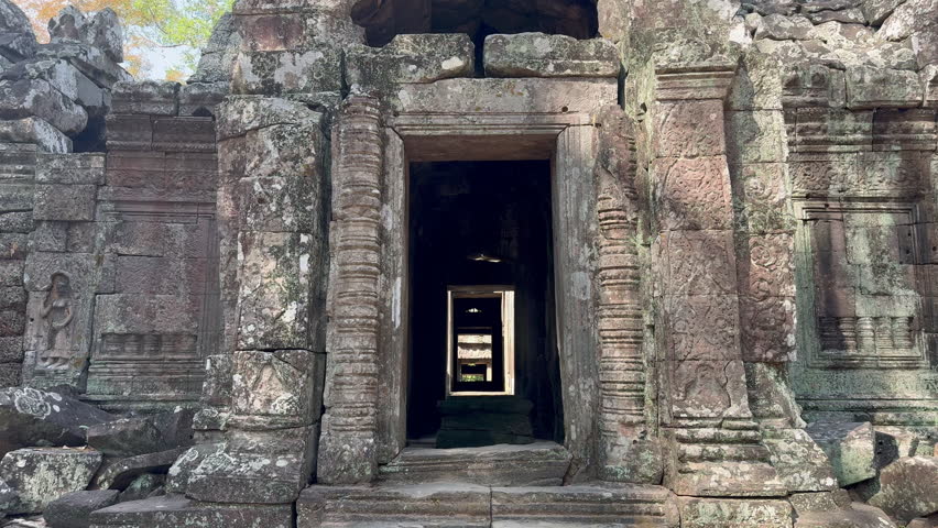 Vertical Pan on the entrance of the Buddhist temple Ta Som, dedicated to Jayavarman VII at the Angkor site in Cambodia. Check the gallery for similar footages. Royalty-Free Stock Footage #3420617411