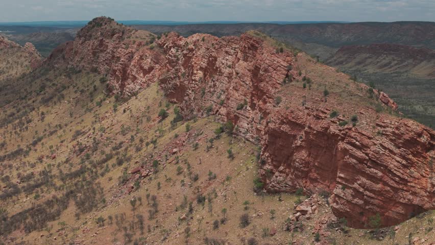 An aerial view of the rugged mountain ranges of the MacDonnell Ranges situated in the Northern Territory, Australia
