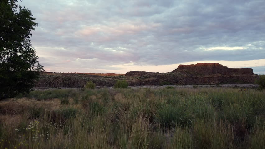 Camera zooms pans up over the Eastern Washington Desert at Dawn Royalty-Free Stock Footage #3420662007