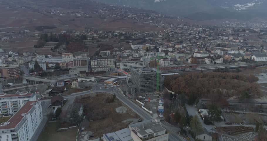 Sierre rail station rotative traveling - Aerial 4K