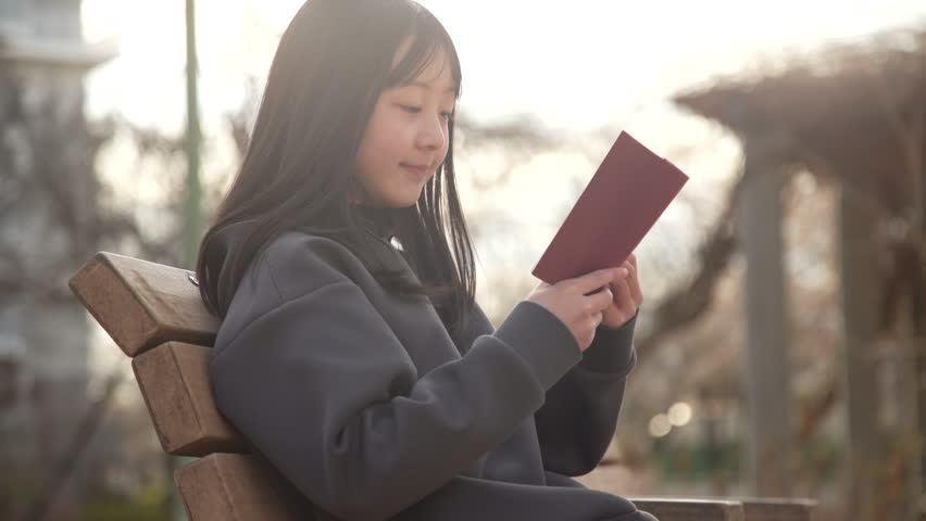 girl reading a book in the park
 Royalty-Free Stock Footage #3420803365