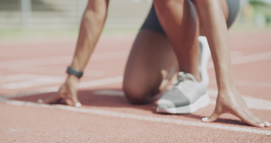 Person, hands and runner on start line for race, sprint or athletics in outdoor competition on stadium track. Closeup of athlete getting ready for running, training or exercise in sports marathon